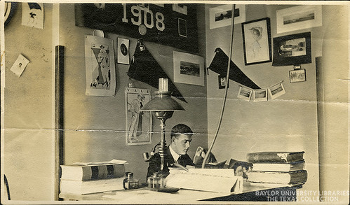 A Baylor Student at desk in dorm room, c. 1910