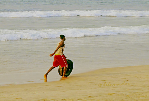 ghanaaccra africa african boy rolling tyre atlantic ocean beach gηανα solo travel bilwander westafrica ghana west