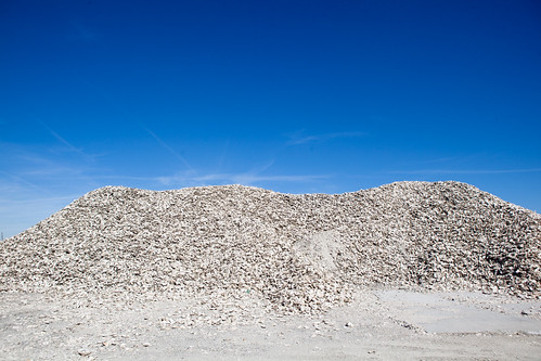 Oyster shell in Chesapeake, Va. by chesbayprogram, Roughly 1,000 cubic yards, or about 30 truckloads, of shucked oyster shell is stored by the Elizabet