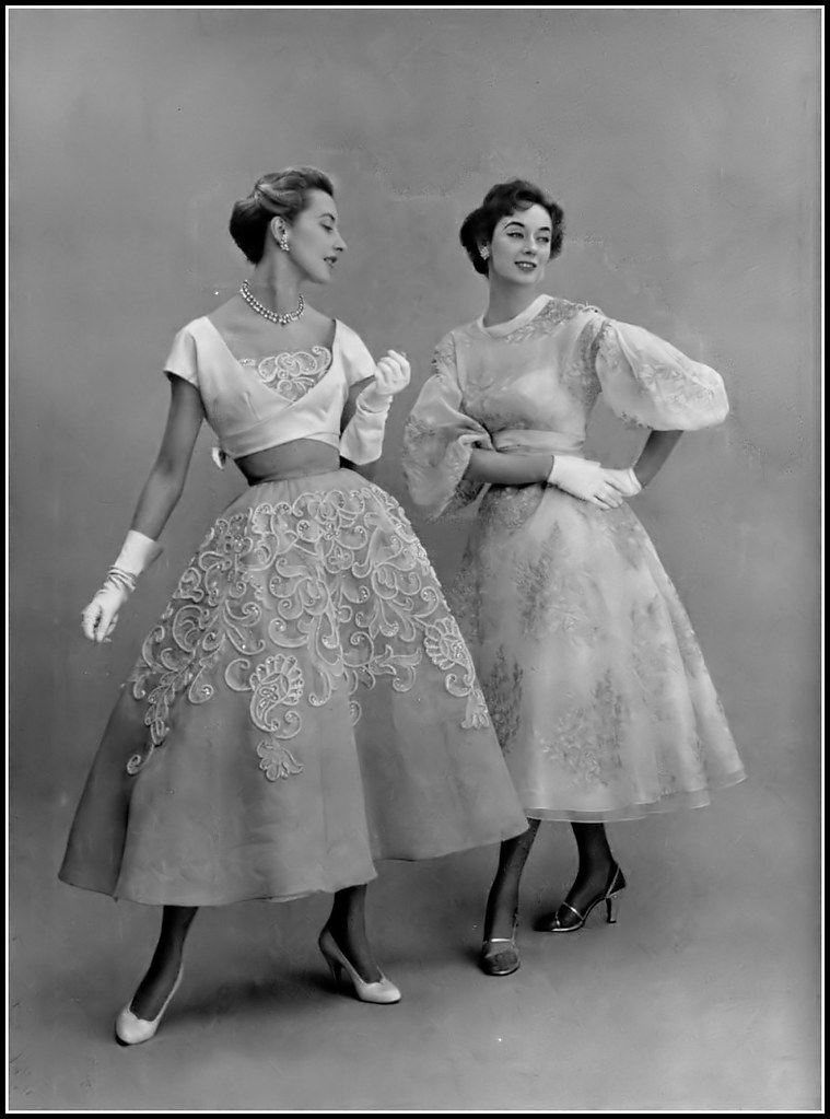 Marie-Thérèse (l) in embroidered organdy dress by Pierre Balmain and Elinor (r) in mauve organdy print by Lanvin-Castillo, photo by Pottier, 1954