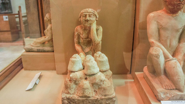 An ancient Egyptian statuette of bread seller at the Egyptian Museum of Cairo