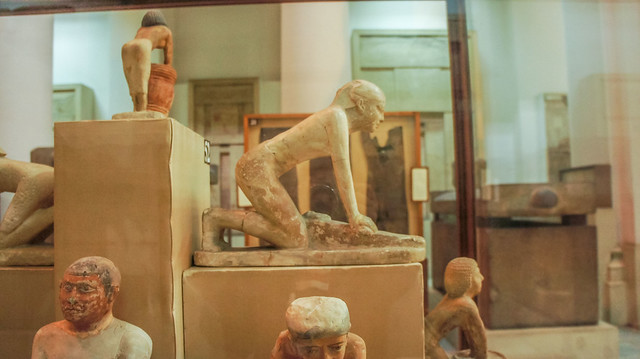 Ancient Egyptian statute of Ishat grinding at the Egyptian Museum of Cairo