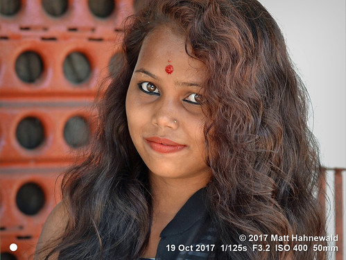 facingtheworld head face forehead tilaka thirdeye eyes bigeyes eyemakeup mouth lips lipstick red hair curly lifestyle beauty puja hinduism temple tezpur assam india asia asian indian assamese mahabhairav female girl young woman nikond3100 primelens 50mm street portrait outdoor posing authentic smiling beautiful attractive sensual pretty stunning captivating northeast expression nikkorafs50mmf18g threequarterview clarity colour person cultural emotional closeup lookingatcamera headshot sharpness matthahnewald