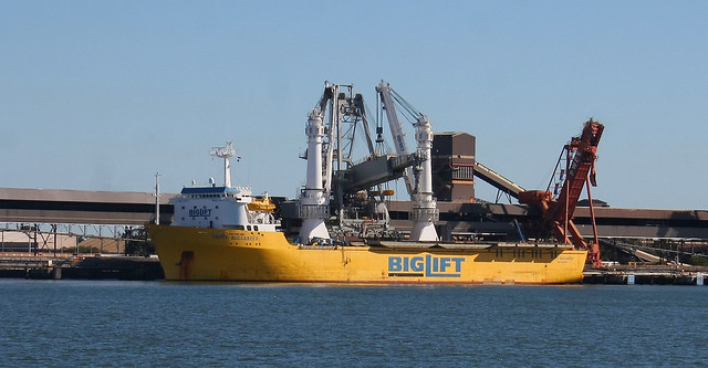 () Heavy Lift vessel ' HAPPY BUCCANEER' unloading new coal loader arms at Port Waratah Coal Services facility at Carrington, Port of Newcastle on 30th July 2016.