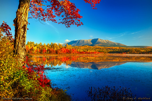 Mt. Katahdin in Maine by Greg from Maine, This shows Mt. Katahdin shortly after sunrise during autumn as seen from Compass Pond near the Golde