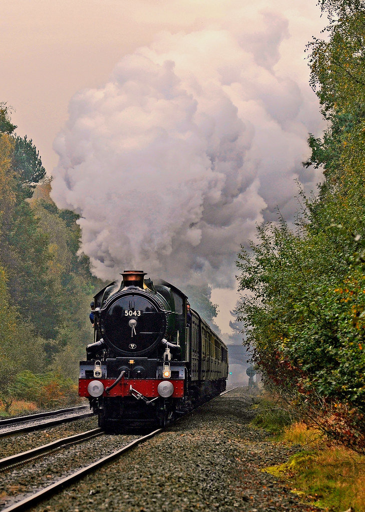 GWR Castle Class 4-6-0 no 5043 Earl of Mount Edgcumbe approaching Streetly Gate foot crossing in Sutton Park.