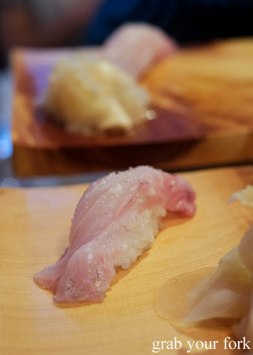 Bass grouper nigiri sushi, part of the omakase sushi menu at Osaka Bar in Darlinghurst Sydney