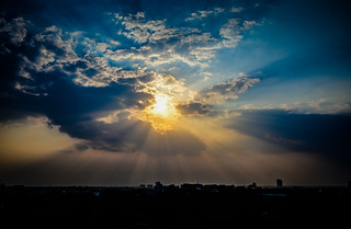 Late Afternoon Sun rays peaking through the clouds - viewed from JW Marriott Hotel Bengaluru - Bangalore India