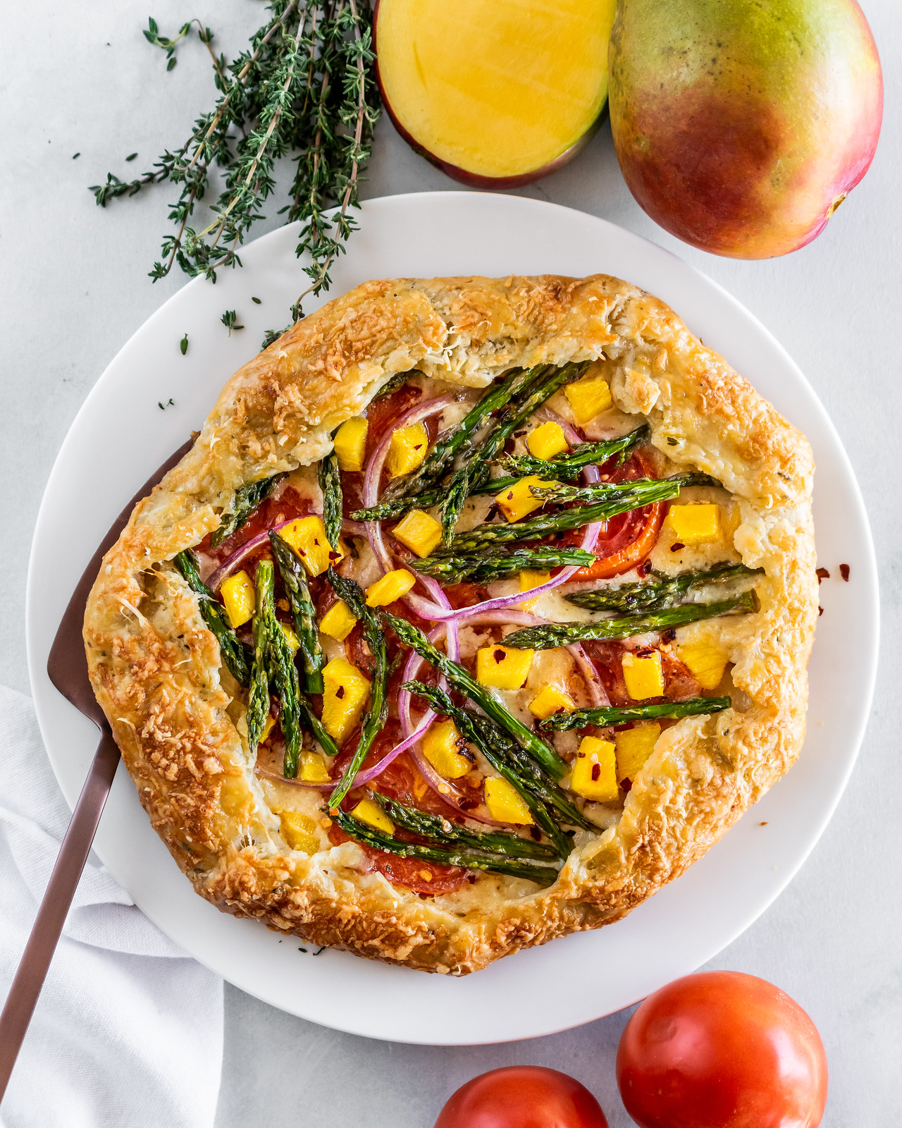 spring galette with asparagus, gruyère, and mango