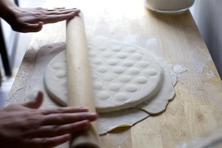 add the top dough and roll to encase the filling