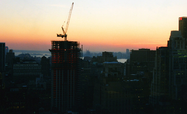 Sunset from my office in Midtown. A zoom shot brings Jersey City, the Hudson and the Statue of Liberty closer. Missing was the World Trade Center, which always hovered over everything else. Three months after 9/11, I missed it deeply. New York. Dec 2001.