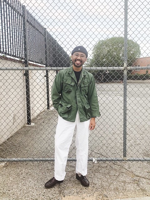 Ethan - milsurp boys Spencer, Mj - beanie. Navy crew neck sweater, jungle jacket, white wide leg chinos, cream socks, penny loafers