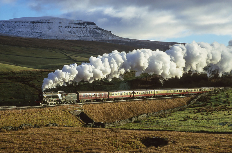 Ex LNER V2 60800 'Green Arrow' climbs past a snow covered Pen - y - ghent in beautiful Winter lighting conditions hauling a northbound 'Cumbrian Mountain Express' on December 29th 1999.