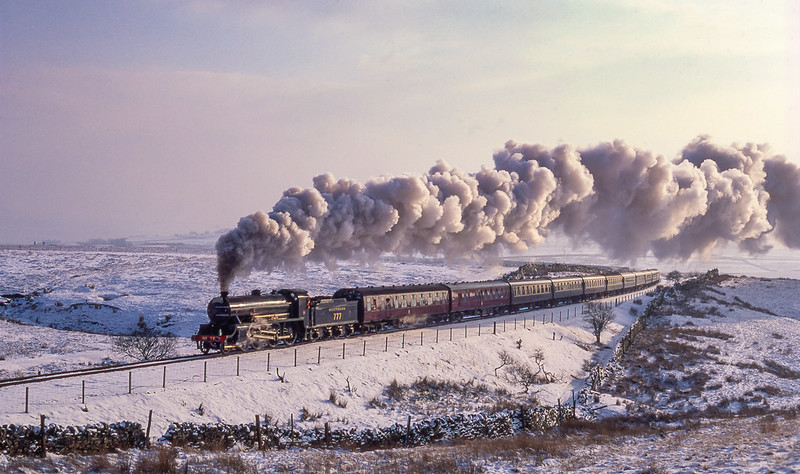 With Winter fast approaching a look back to the S&C thirty years ago with 777 'Sir Lamiel' running without smoke deflectors heading a northbound 'Cumbrian Mountain Express' towards Blea Moor signal box in the snow covered landscape. Most of the S&C that day was covered in a blanket of thick mist although a few locations were fairly clear as was this area around Blea Moor on February 2nd 1991.
( This is a re-scan and process of an earlier post )