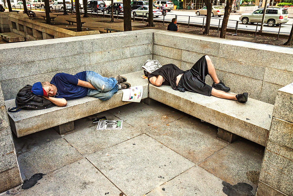 Two-men-sleeping,-one-with-newspaper-on-face--Center-City