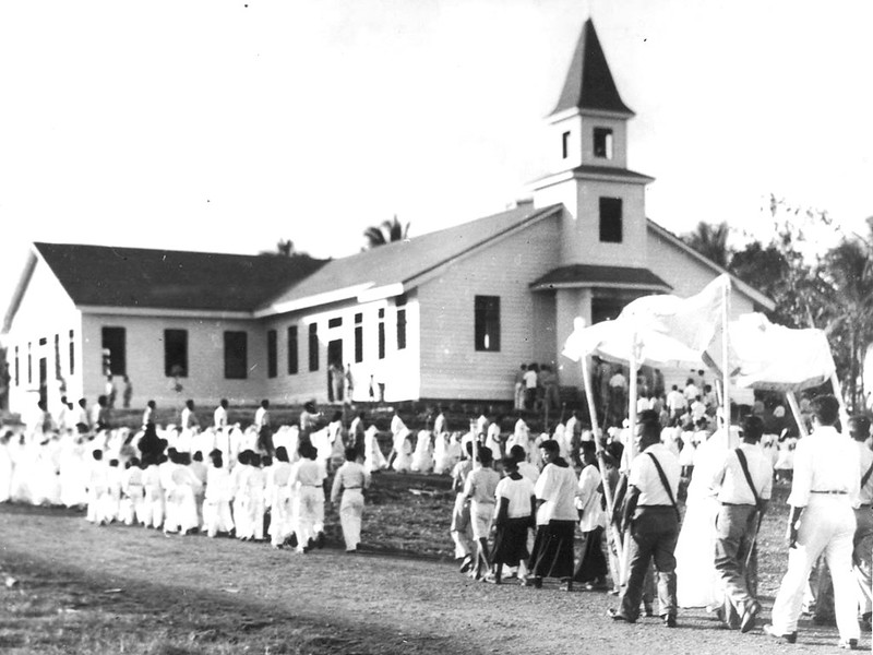 In this historic photo, several villagers, clad in white, walk in a religious procession in Barrigada during a patron saint's feast day. The village celebrates three fiestas throughout the year for San Vicente, San Roke, and San Ramon.

Capuchin Order, Guam