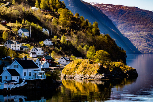 countryside mountains norway water calm fishingvillage fjord houses reflections rock shoreline