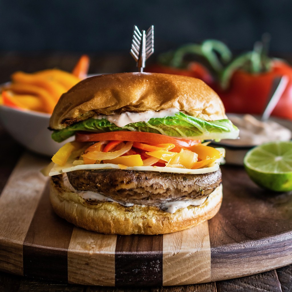 citrus-marinated grilled portobello burgers with sautéed peppers and chipotle mayo