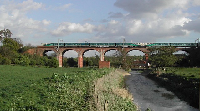 River Colne Viaduct outside Colchester with Great Eastern Class 312 EMUs passing in 2004