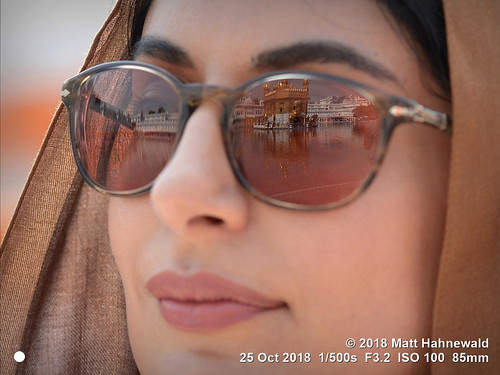 matthahnewaldphotography facingtheworld face eyes sunglasses mirror lips story relationship beauty art religious traditional cultural holy goldentemple sriharmandarsahib sikhism temple tourist amritsar punjab india asia asian indian female young woman photography detail naturalframe nikond610 nikkorafs85mmf18g 85mm resized 1200x900pixels horizontal street portrait closeup faceshot cropped tightcrop threequarterview outdoor photoshop postprocessing editing posing beautiful attractive pretty sightseeing clarity gurdwara worship colour person conceptual 4x3ratio consensual mirrored reflection