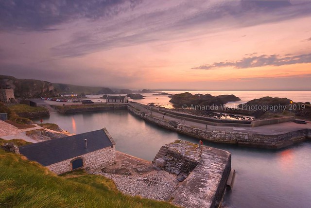 A Break In The Clouds  Sunset overlooking Ballintoy Harbour