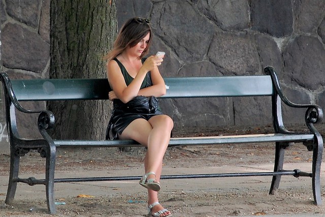 Girl on the real original Copenhagen bench