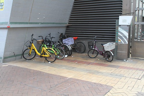 Mix of bikes parked outside the Tai Po Hui Market