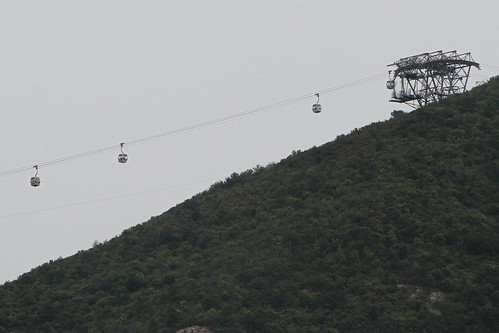 Ngong Ping 360 cable car heads up the hills at Tower 3 on Lantau Island