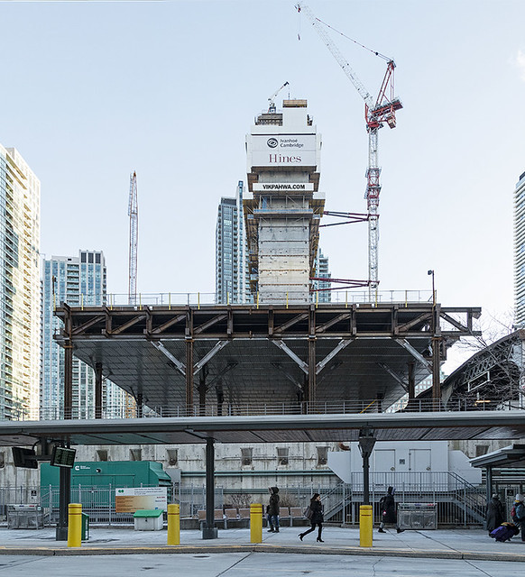 20190520. The first CIBC Square tower and the steel support structure for its park rise behind the current Union Station Bus terminal, which is the future site of the second CIBC Square tower.