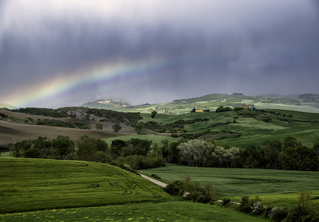 Rainbow during rain showers over Monticchiello