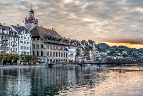 switzerland lucerne sony a73 river sunrise europe reflections sun flags tower sky clouds