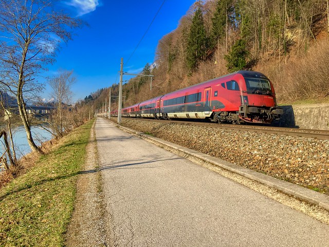 ÖBB railjet express train passing the river Inn between Kiefersfelden and Kufstein in Tyrol, Austria