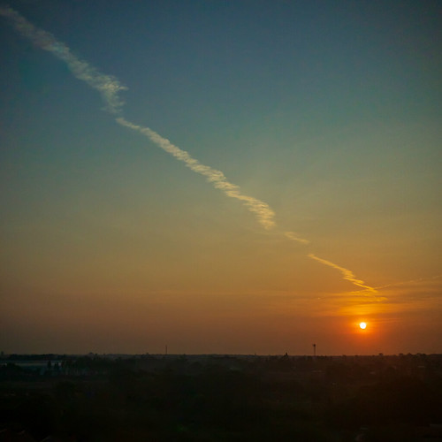 Sunrise @ Kantary 304, Prachinburi by hathaway_m, From the 6th floor window in the Kantary hotel in Prachinburi, I like the line of the jet trail lead