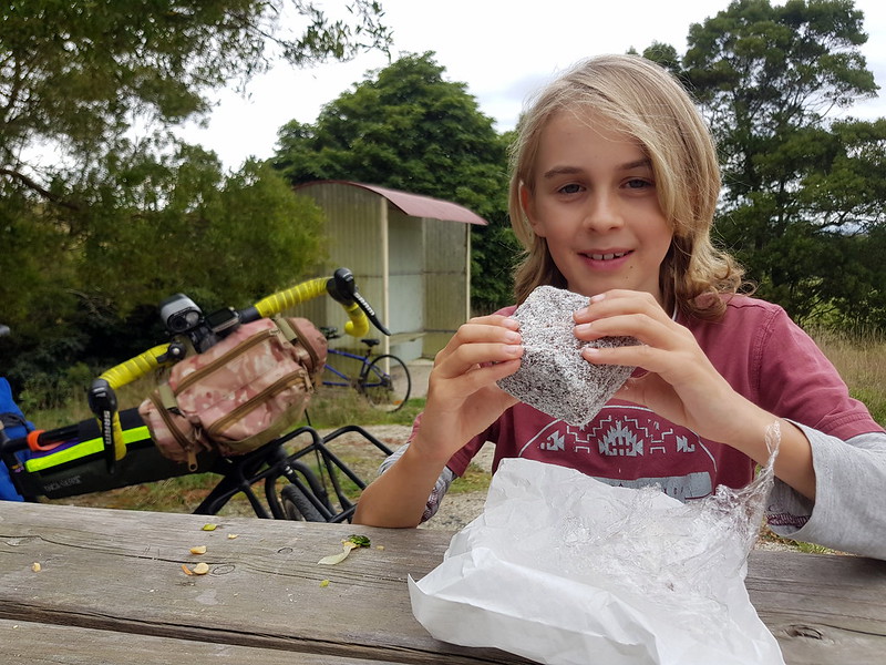 Enjoying the enormous Foster lamington at Hoddle lookout on the Great Southern Rail Trail