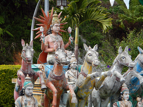 Sculpture of a god riding a chariot drawn by horses in a HinduTemple in the Cameron Highlands of Malaysia