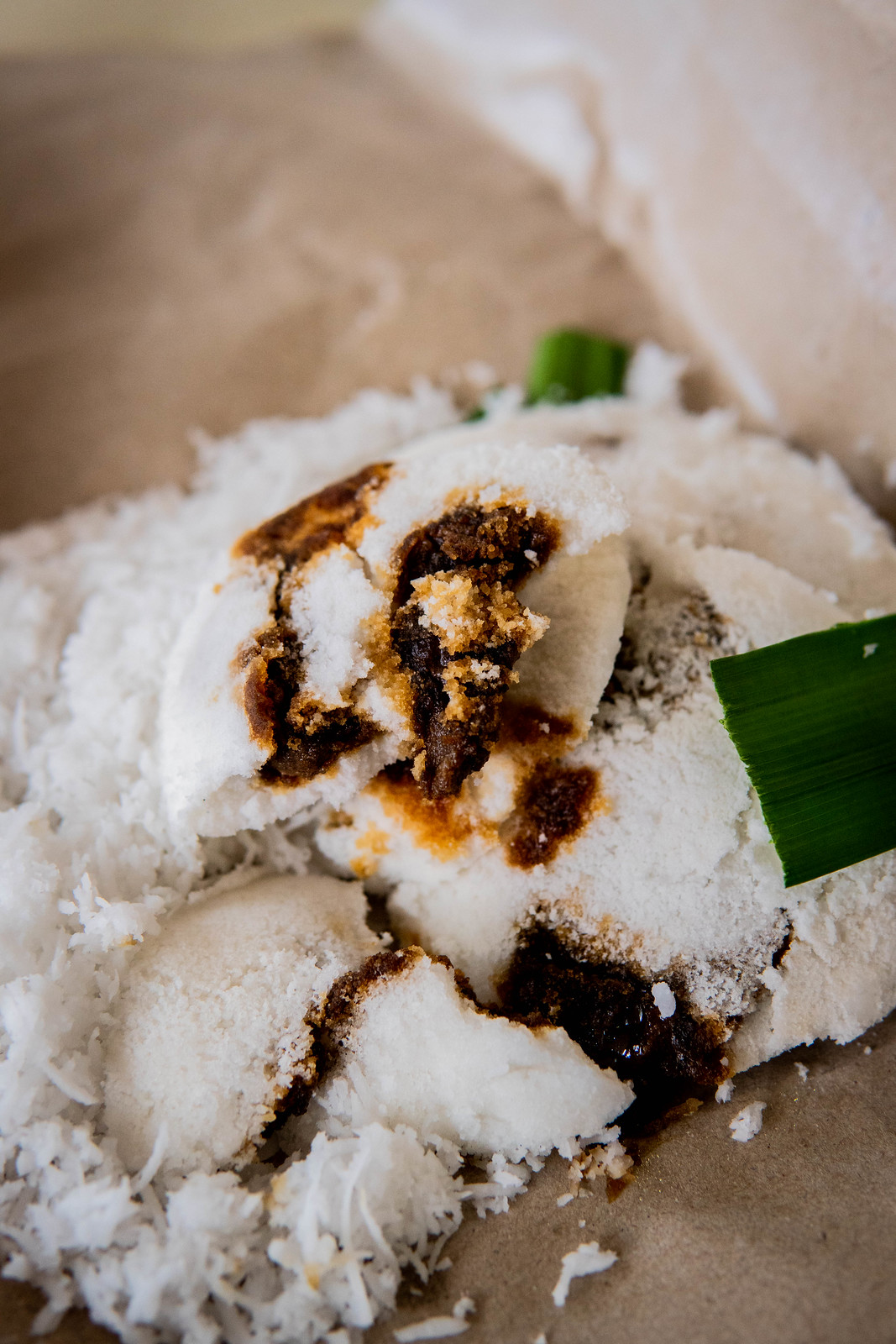 Half eaten Putu Piring with Gula Melaka in the centre