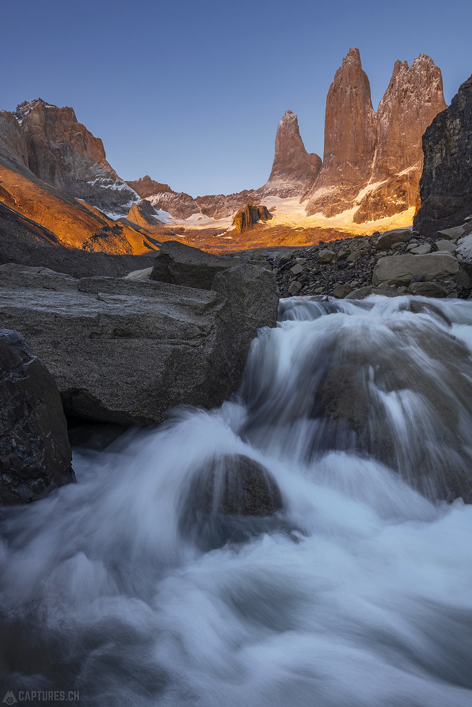 Waterfall and the towers at sunrise - Torres del Paine