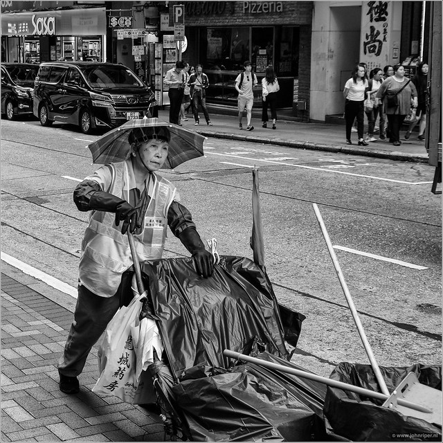 Sun protected street cleaner in Hong Kong