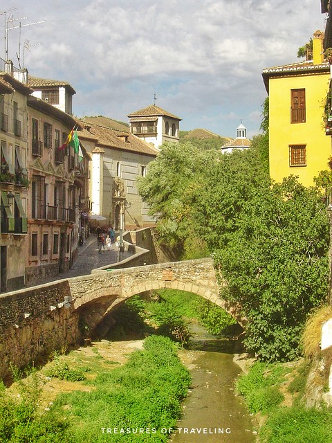 After a full day of exploring the Albaicín, take a walk on the road that runs along the Darro River called the The Carrera del Darro which takes you back to downtown Granada. As you walk along the road don't forget to look up to see the Alhambra, which si