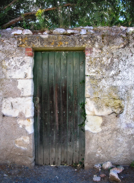 Green door in a stone wall
