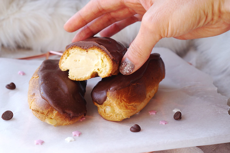 Homemade gluten free eclairs filled with pastry cream and covered in chocolate icing | Recipe