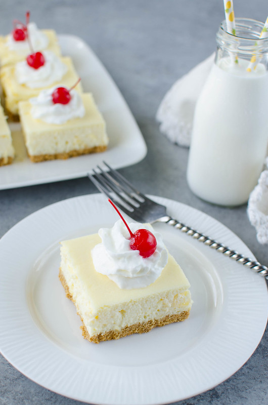 Pineapple Cheesecake Bars - creamy cheesecake filled with pineapple on a graham cracker crust. An easy recipe that comes out perfect every time! 