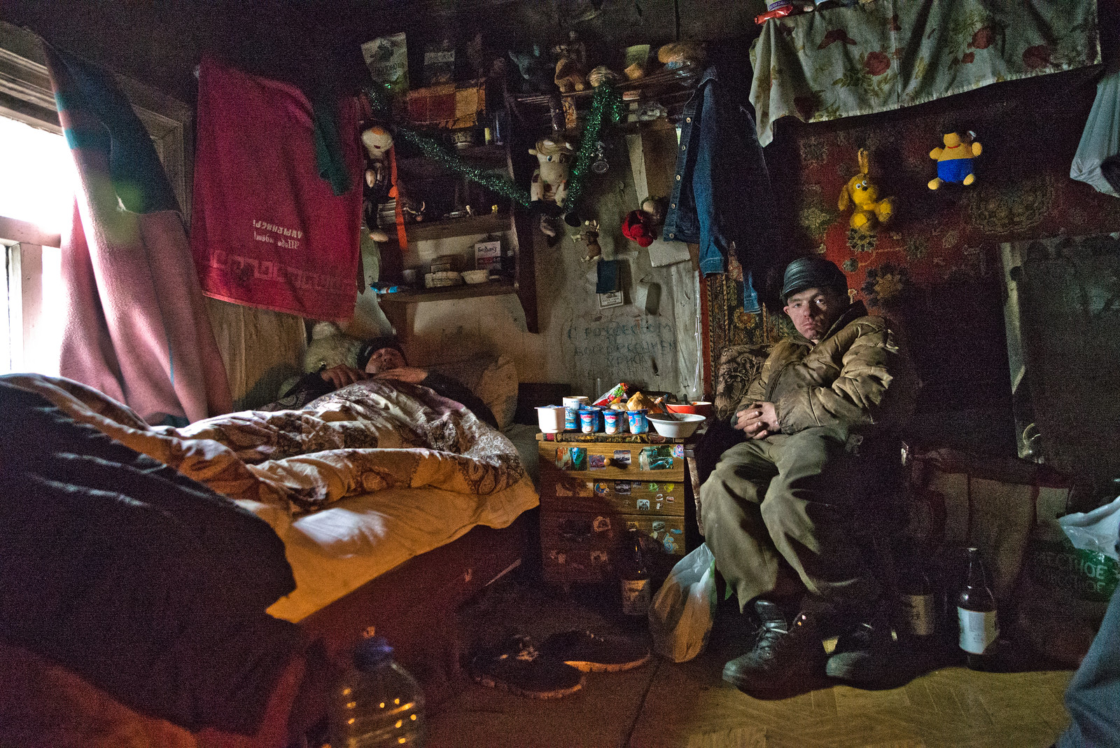 Homeless people living in an abandoned cottage in Minsk (Belarus)
