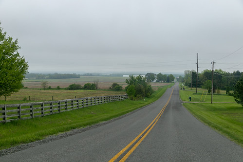 landscape rural farmland eastliberty ohio unitedstatesofamerica hilltop road pavement zanetownship middleburg logancounty trees field hills fence