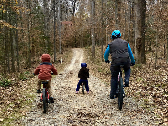 Family bike ride in the fall
