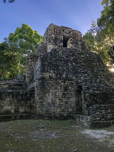 chenes rio bec style blue sky trees sunset rainforest grass mayan architecture maya art arc rocks bricks building pyramid archeological site archeology chaac masks itzamna lintel mouth old ancient ruins el hormiguero calakmul reserve mexico campeche