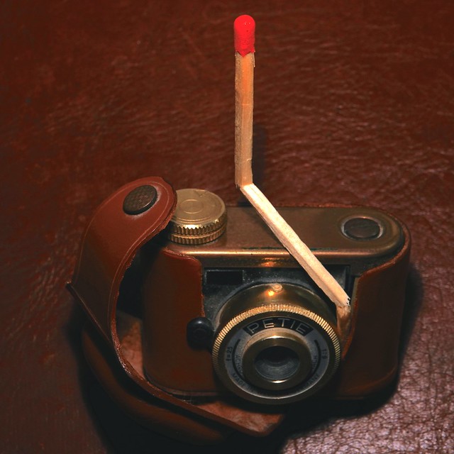 Antique flash bulb on tiny camera