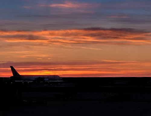 plane airplane sunrise sky orange blue