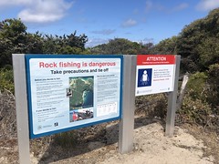 Rock fishing warning signs at Salmon Holes Beach