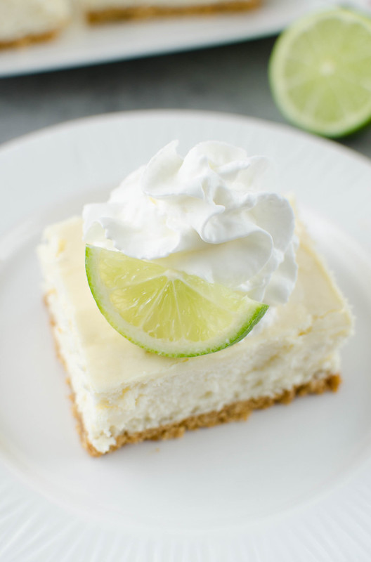 Key Lime Cheesecake Bars - creamy cheesecake bars filled with key lime juice and fresh lime zest on a graham cracker crust. 